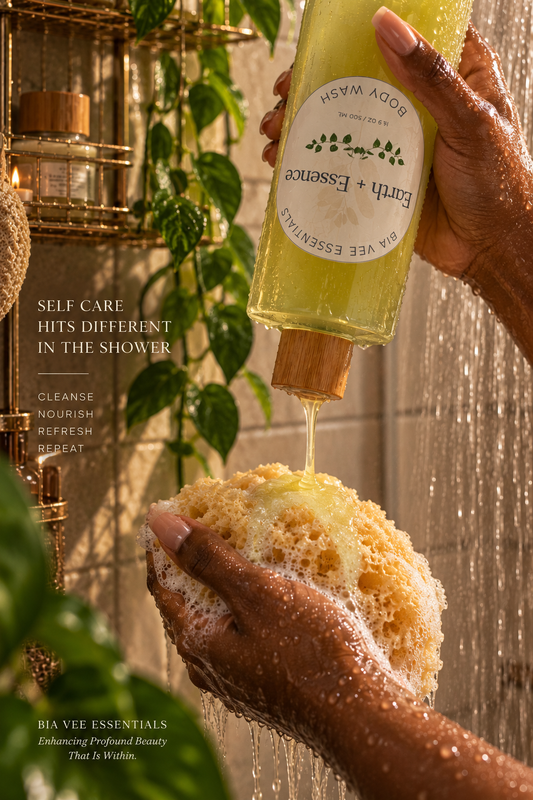 A person holds a bottle of Earth + Essence body wash and pours yellow-green liquid soap onto a sponge while being showered. The scene includes shower walls, water droplets, and text overlays promoting self-care benefits.